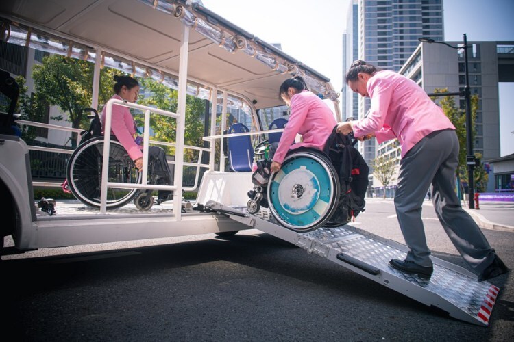 Members of China's delegation get on a barrier-free shuttle in the 4th Asian Para Games Village in Hangzhou, east China's Zhejiang Province, Oct. 16, 2023. (Xinhua/Jiang Han)