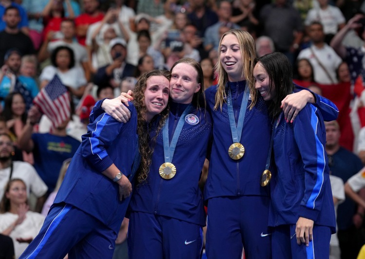 Gold medalists team USA attend the victory ceremony for the women's 4 x 100m medley relay of swimming at Paris 2024 Olympic Games in Paris, France, on Aug. 4, 2024. (Xinhua/Du Yu)