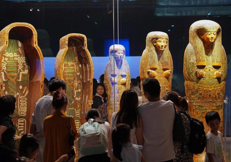 People visit the exhibition "On Top of the Pyramid: The Civilization of Ancient Egypt" at the Shanghai Museum at night in Shanghai, east China, Aug. 11, 2025. (Xinhua/Liu Ying)